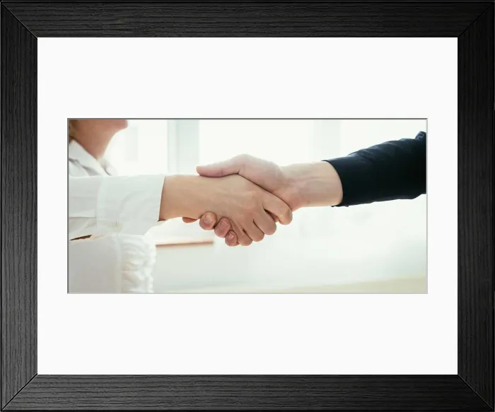 Framed Print : Shaking hands, concept for teamwork: Close up of man and woman shaking hands in the office Framed Print : Shaking hands, concept for teamwork: Close up of man and woman shaking hands in the office