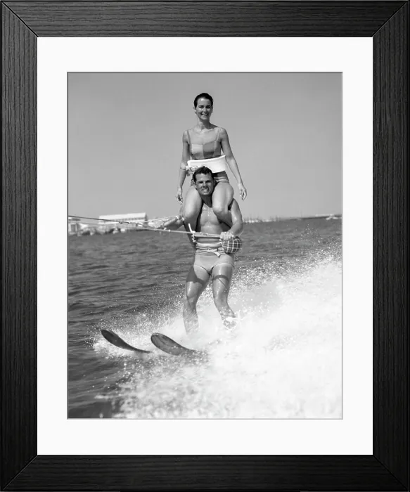 Framed Print : 1960S Man Water Skiing With Woman In Bathing Suit Riding On Shoulders Framed Print : 1960S Man Water Skiing With Woman In Bathing Suit Riding On Shoulders