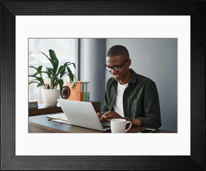 Framed Print : Business, laptop and happy black man typing in office for software