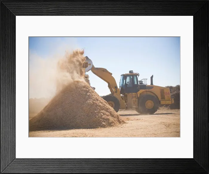 Framed Print : Wood products being processed into wood chips Framed Print : Wood products being processed into wood chips