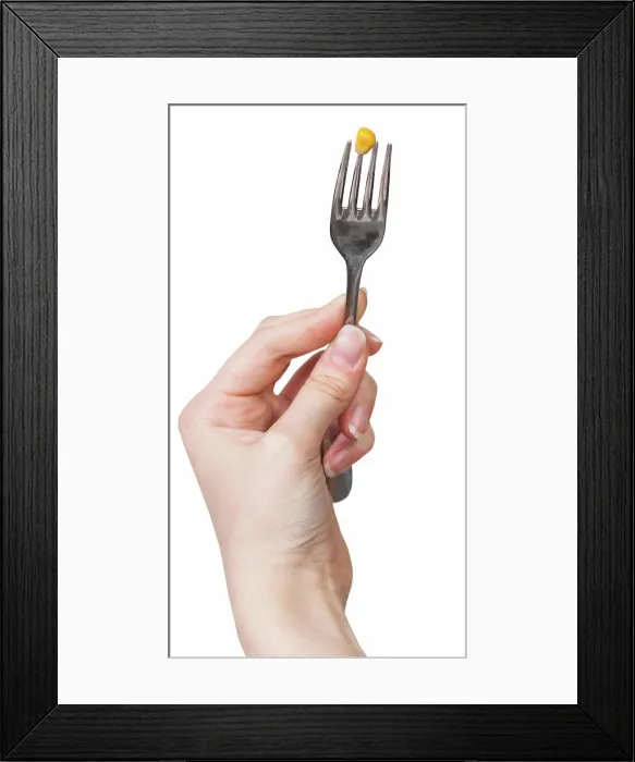 Framed Print : yellow maize seed impaled on fork in female hand one yellow maize seed impaled on fork in female hand isolated on white Framed Print : yellow maize seed impaled on fork in female hand one yellow maize seed impaled on fork in female hand isolated on white