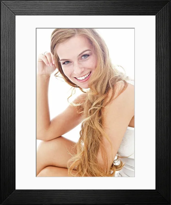 Framed Print : Smiling long-haired young woman Framed Print : Smiling long-haired young woman