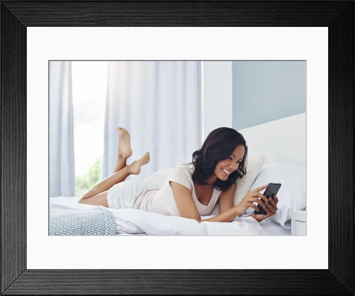 Framed Print : Woman, bedroom and smile with smartphone in house Framed Print : Woman, bedroom and smile with smartphone in house