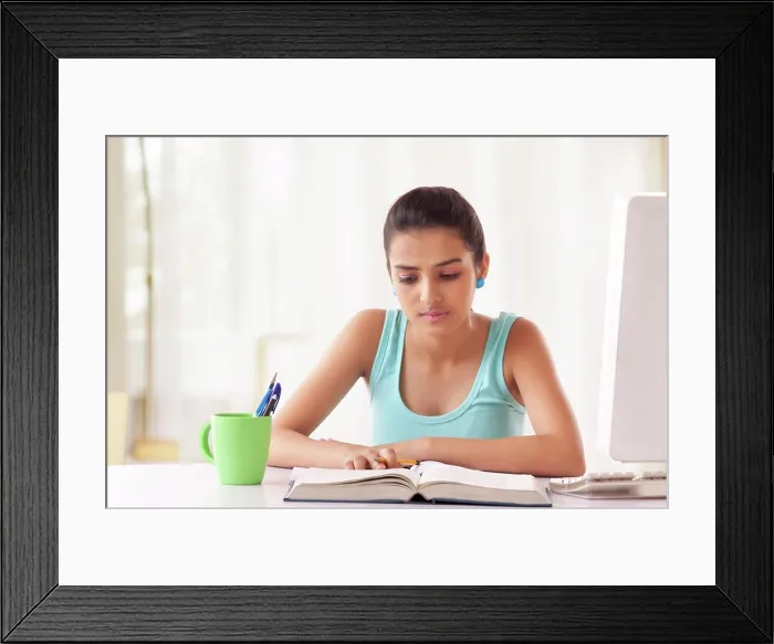 Framed Print : Portrait of Teenage Girls student studying at the table Framed Print : Portrait of Teenage Girls student studying at the table