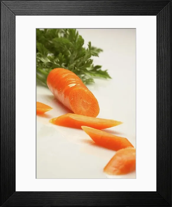 Framed Print : Close-up of slices of a carrot Framed Print : Close-up of slices of a carrot