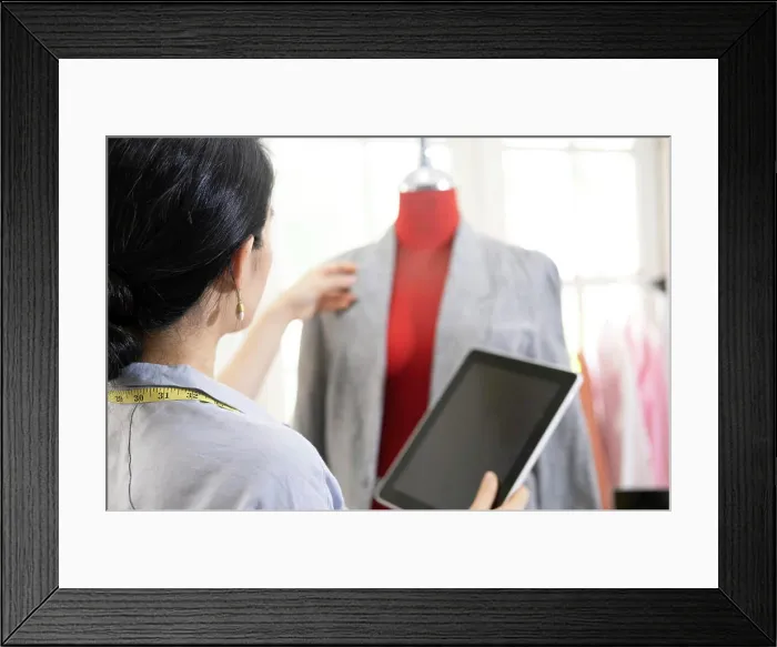 Framed Print : Fashion designer working in atelier Framed Print : Fashion designer working in atelier