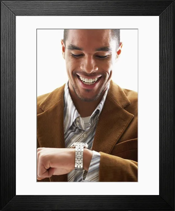 Framed Print : Man Looking at Wristwatch Framed Print : Man Looking at Wristwatch