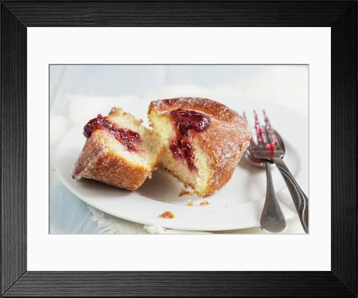 Framed Print : A doughnut muffin with raspberry jam, sliced