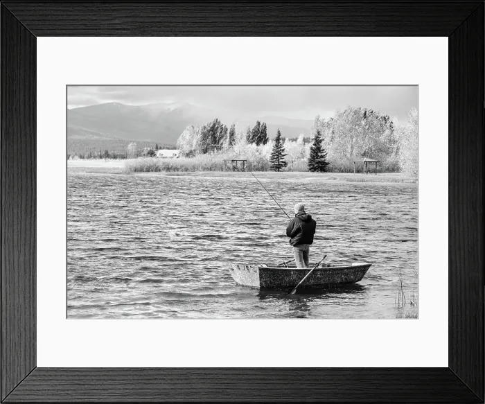 Framed Print : Solo fisherman standing in small boat on Frenchtown Lake, Montana Framed Print : Solo fisherman standing in small boat on Frenchtown Lake, Montana