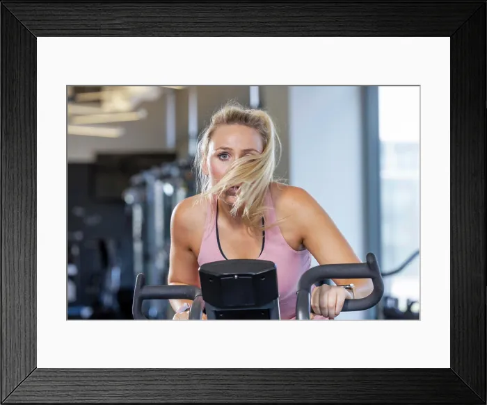 Framed Print : Cycling workout: boost your fitness and endurance at the gym Framed Print : Cycling workout: boost your fitness and endurance at the gym