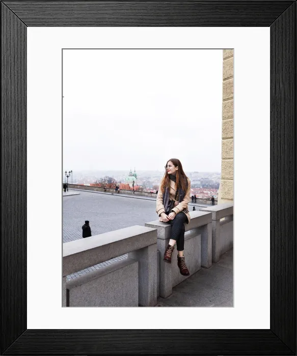 Framed Print : brown-haired woman in a coat on the streets of a European city
