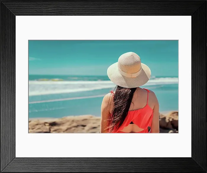 Framed Print : Woman in hat from back to the sea