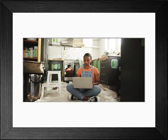 Framed Print : Painting, laptop and woman in home for renovation Framed Print : Painting, laptop and woman in home for renovation