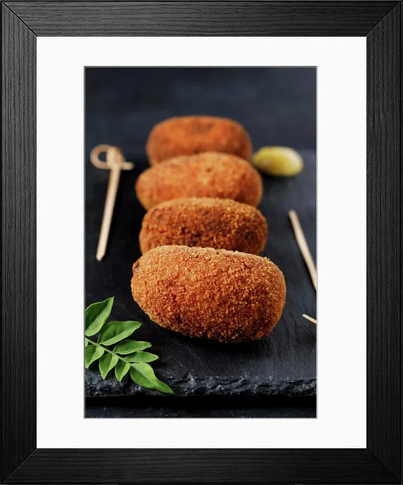Framed Print : Portrait of gourmet style ham croquettes with black background Framed Print : Portrait of gourmet style ham croquettes with black background