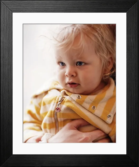 Framed Print : Parent holding baby boy, close-up Framed Print : Parent holding baby boy, close-up