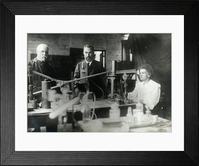 Framed Print : Marie and Pierre Curie (centre) with a man, using equipment in their laboratory, Paris. Photograph, ca. 1900 Framed Print : Marie and Pierre Curie (centre) with a man, using equipment in their laboratory, Paris. Photograph, ca. 1900