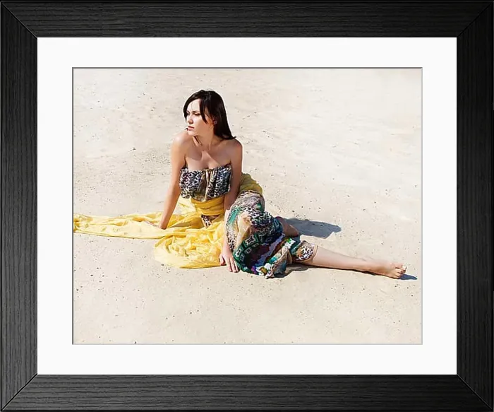 Framed Print : Beautiful woman on the beach sitting on the sand Framed Print : Beautiful woman on the beach sitting on the sand