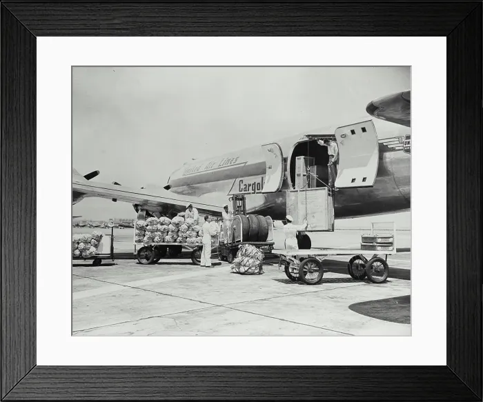 Framed Print : Vintage photograph. Four engined United Air Line Cargoliner 230 exterior view showing loading of cargo on tarmac Framed Print : Vintage photograph. Four engined United Air Line Cargoliner 230 exterior view showing loading of cargo on tarmac