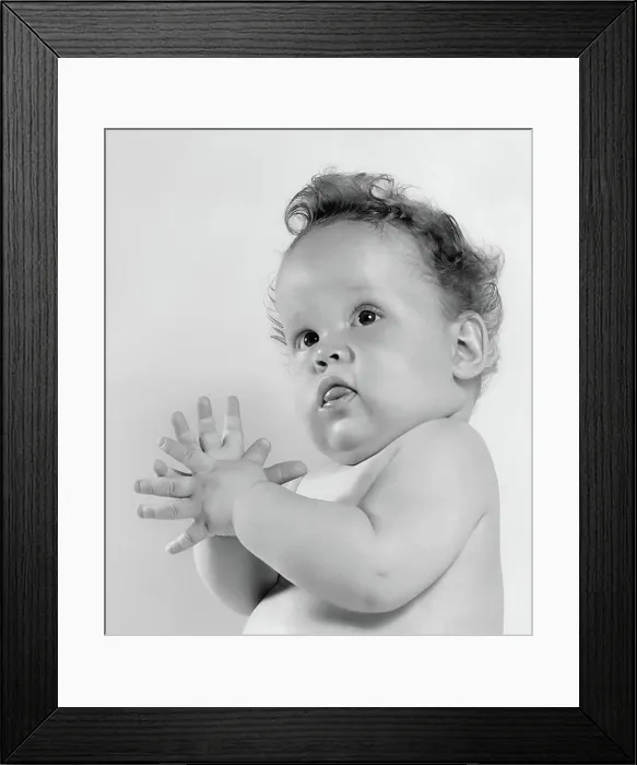 Framed Print : Adorable baby in black and white portrait with curly hair and curious expression Framed Print : Adorable baby in black and white portrait with curly hair and curious expression