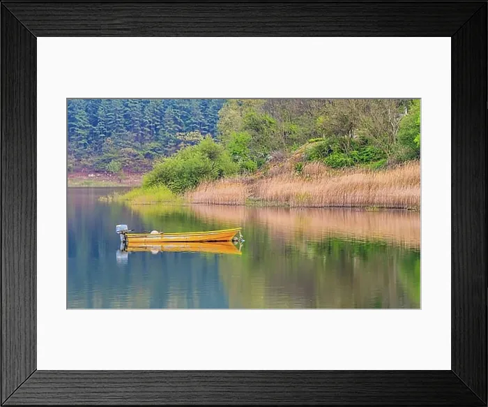 Framed Print : Small yellow metal fishing boat with small engine mount floating peacefully on a lake in South Korea Framed Print : Small yellow metal fishing boat with small engine mount floating peacefully on a lake in South Korea
