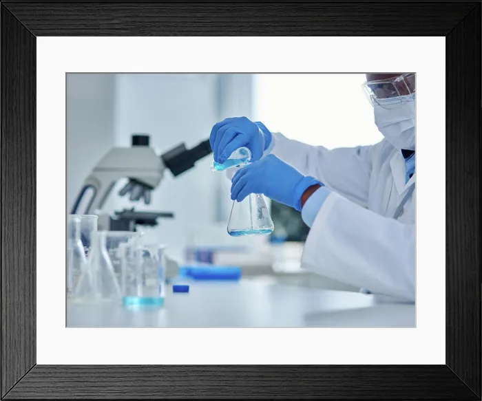 Framed Print : Black person, scientist and liquid in beaker for testing