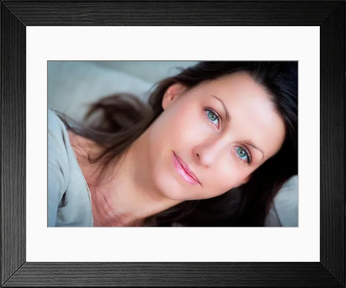 Framed Print : Woman relaxing on a couch Framed Print : Woman relaxing on a couch
