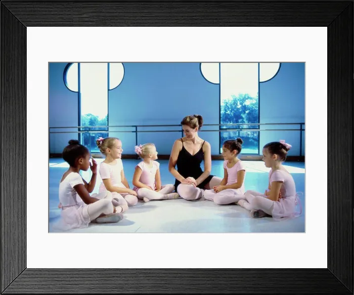 Framed Print : Ballet teacher talking to a group of girls Framed Print : Ballet teacher talking to a group of girls