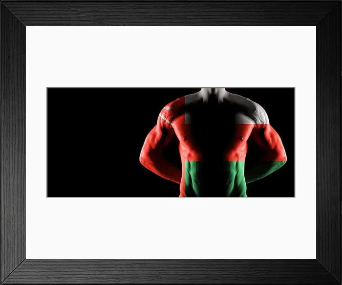 Framed Print : Oman flag on muscled male torso with abs, black background Framed Print : Oman flag on muscled male torso with abs, black background