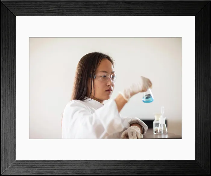 Framed Print : scientist female with sample and tubes in a lab Framed Print : scientist female with sample and tubes in a lab