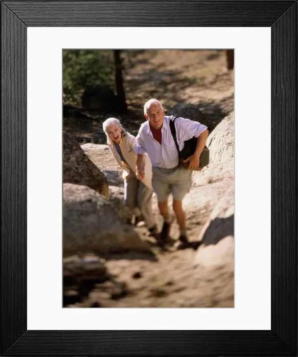 Framed Print : Portrait of a senior couple hiking Framed Print : Portrait of a senior couple hiking