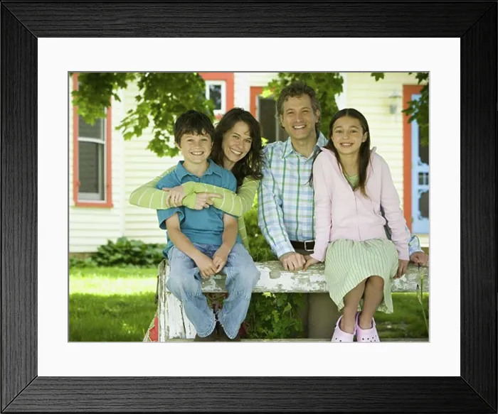 Framed Print : Portrait of a man and a woman smiling with their children