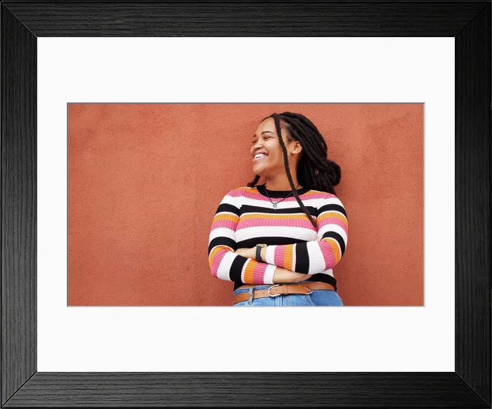 Framed Print : Mockup, proud and black woman relax on orange wall background for advertising Framed Print : Mockup, proud and black woman relax on orange wall background for advertising
