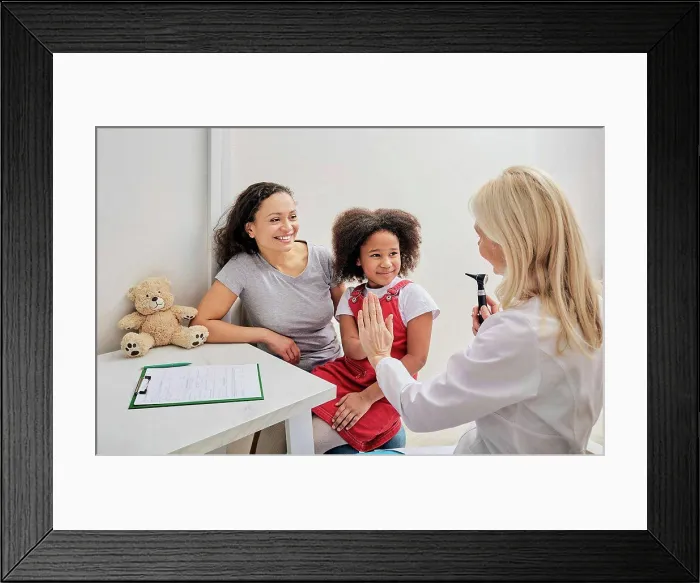 Framed Print : Ear examination Framed Print : Ear examination