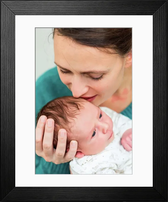 Framed Print : Mother holding her two week old baby boy Framed Print : Mother holding her two week old baby boy