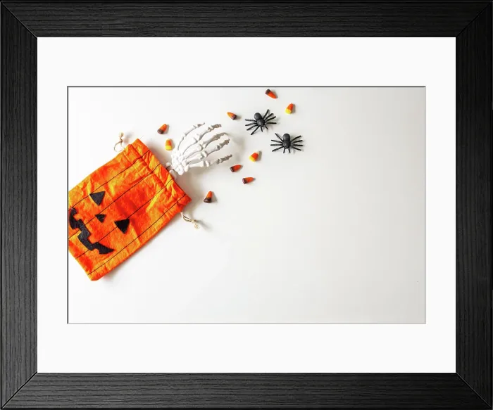 Framed Print : Halloween Flaylay with treat bag, candy corn, spiders