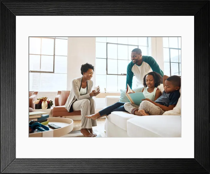Framed Print : Black family, reading book and children on couch with smile