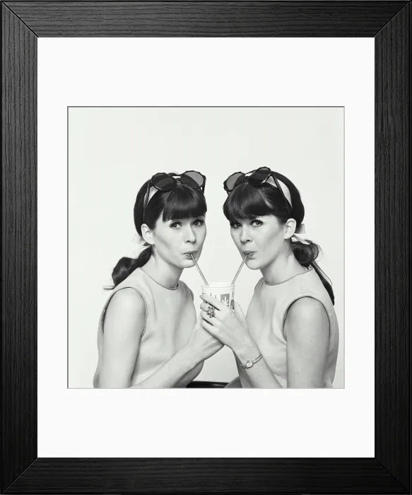 Framed Print : Portrait of twin young women drinking cold drink Framed Print : Portrait of twin young women drinking cold drink