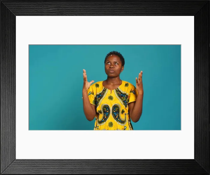 Framed Print : Young positive woman praying to God for health and happiness Framed Print : Young positive woman praying to God for health and happiness