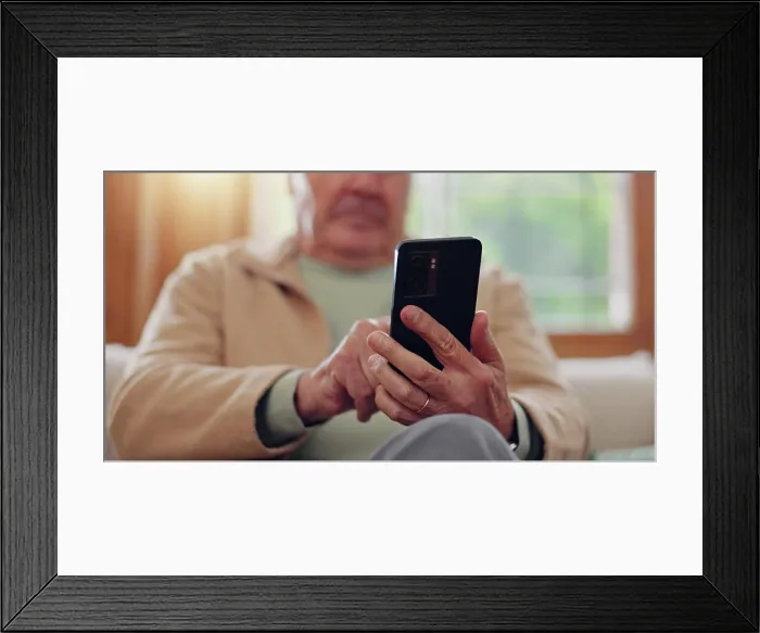 Framed Print : Parkinsons, smartphone and hands of senior man typing online on internet search in retirement home Framed Print : Parkinsons, smartphone and hands of senior man typing online on internet search in retirement home