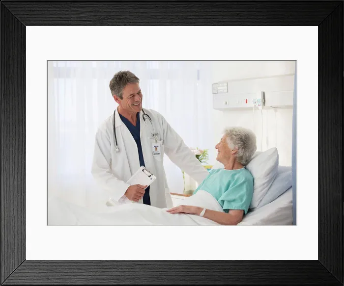 Framed Print : Doctor talking to elderly patient in hospital Framed Print : Doctor talking to elderly patient in hospital