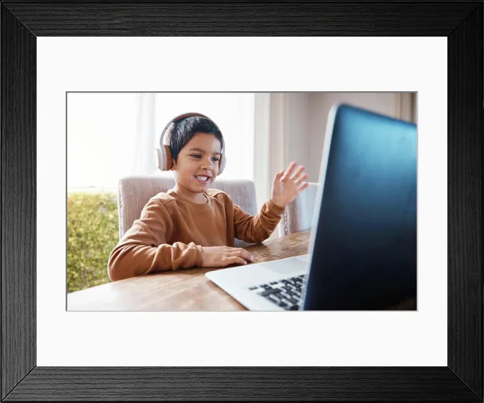 Framed Print : Elearning, wave and kid on laptop video call with headphones for education or studying Framed Print : Elearning, wave and kid on laptop video call with headphones for education or studying