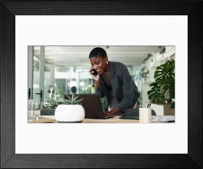 Framed Print : Black woman, phone call and typing on laptop in office Framed Print : Black woman, phone call and typing on laptop in office