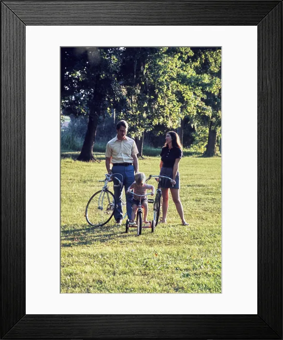 Framed Print : Family enjoying a sunny day with a bike ride in the park Framed Print : Family enjoying a sunny day with a bike ride in the park