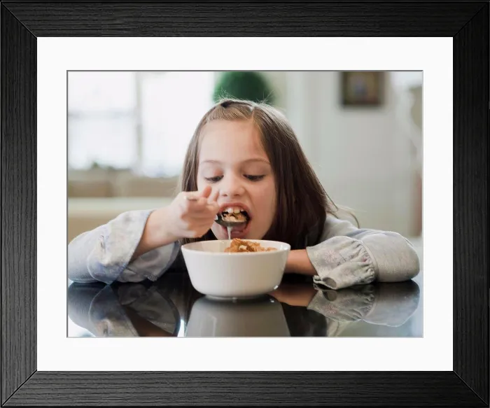 Framed Print : USA, Utah, Alpine, portrait of girl (8-9) eating breakfast