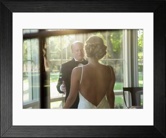 Framed Print : Bride and father of the bride about to embrace celebrating the wedding day, seen through window Framed Print : Bride and father of the bride about to embrace celebrating the wedding day, seen through window
