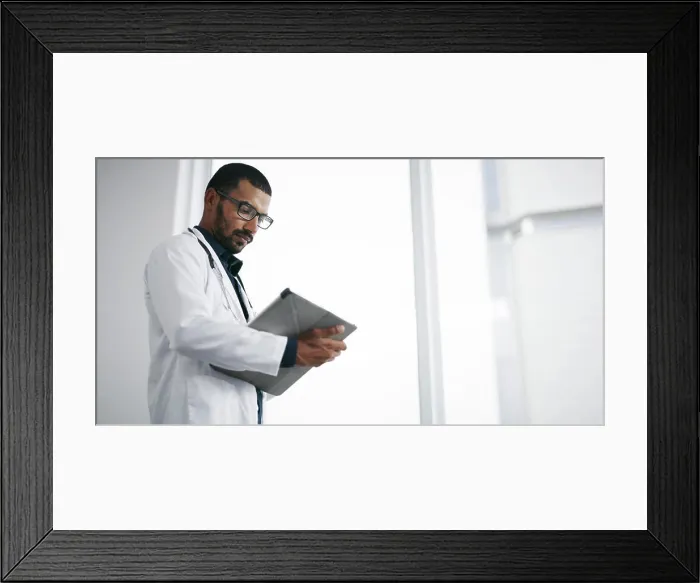 Framed Print : Healthcare, reading and doctor with tablet Framed Print : Healthcare, reading and doctor with tablet