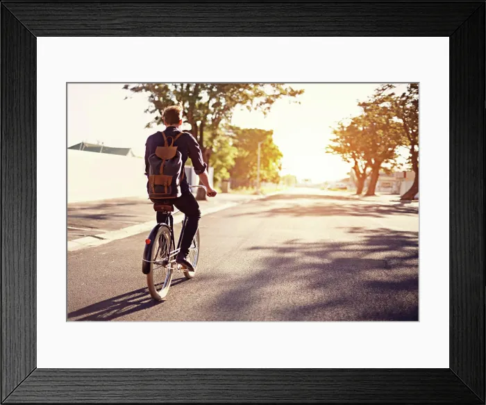Framed Print : Bicycle, transport and back of man in road with lens flare for exercise Framed Print : Bicycle, transport and back of man in road with lens flare for exercise