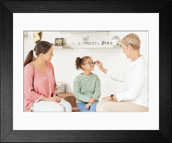 Framed Print : Vision glasses, mother and child with optometrist for eye care consultation