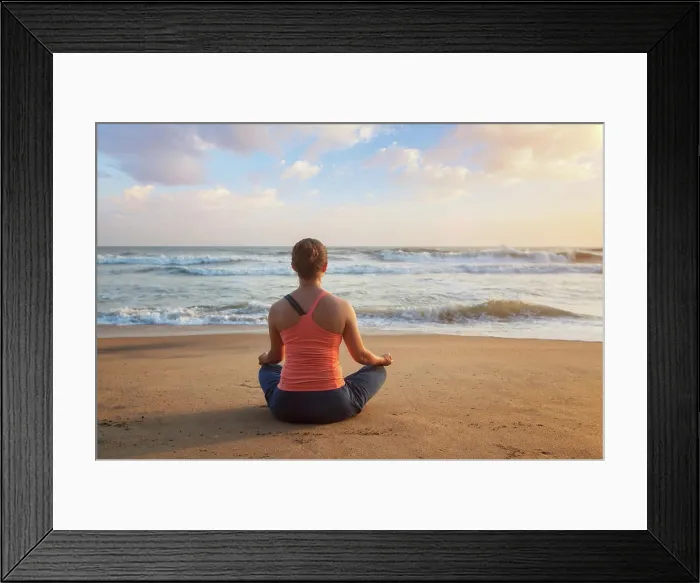 Framed Print : Woman doing yoga - meditating and relaxing in Padmasana Lotus Pose outdoors at tropical beach on sunset Framed Print : Woman doing yoga - meditating and relaxing in Padmasana Lotus Pose outdoors at tropical beach on sunset
