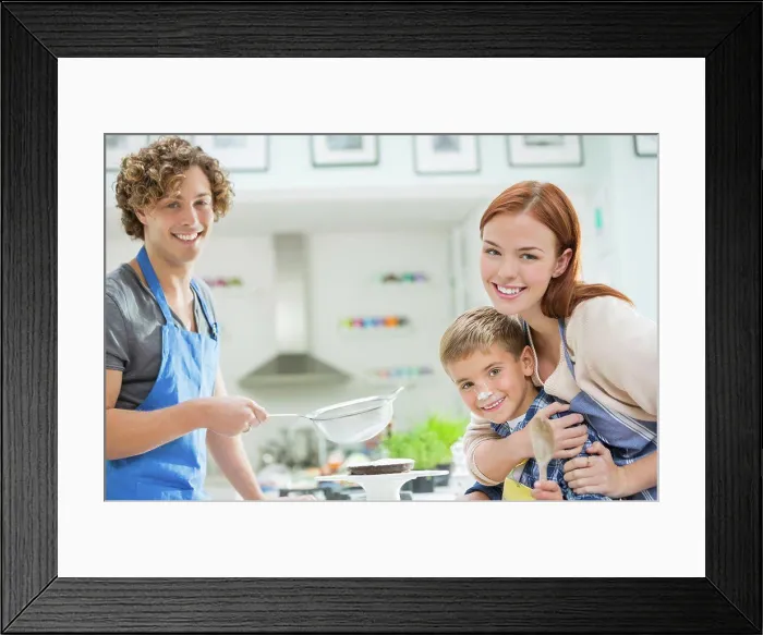 Framed Print : Family cooking together in kitchen, London, UK